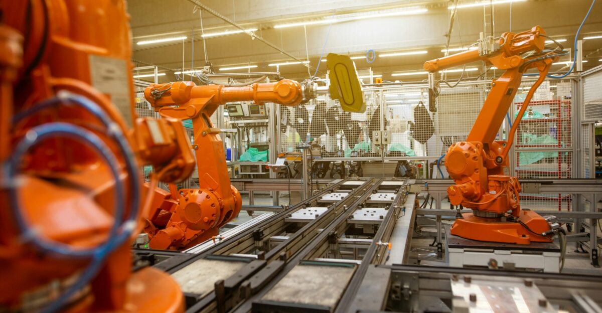a factory filled with lots of orange machines