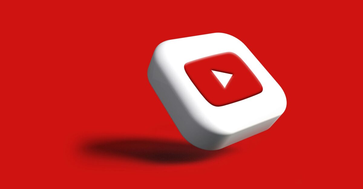 a white cube with a red arrow on a red background