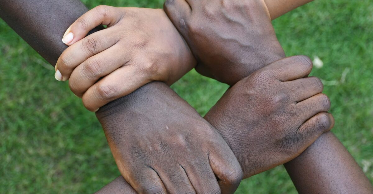 a group of hands holding each other