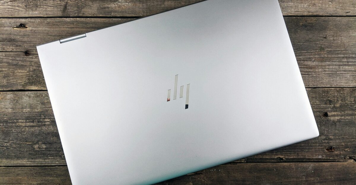 a white rectangular device on a wooden surface