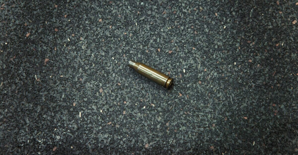a bullet laying on the ground in the middle of the floor