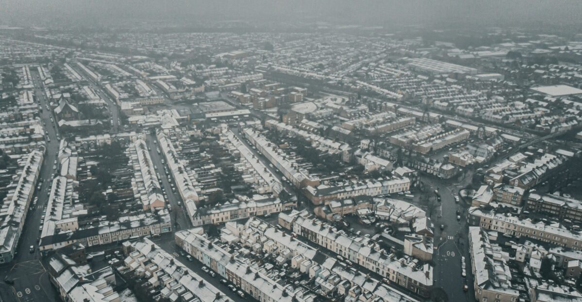an aerial view of a snow covered city