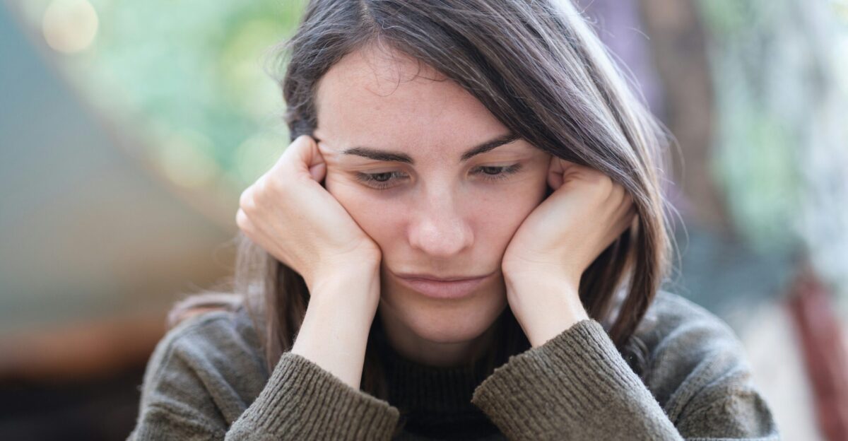a woman holding her head in her hands