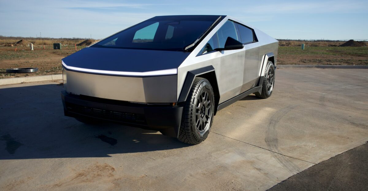 a silver and black car parked in a parking lot