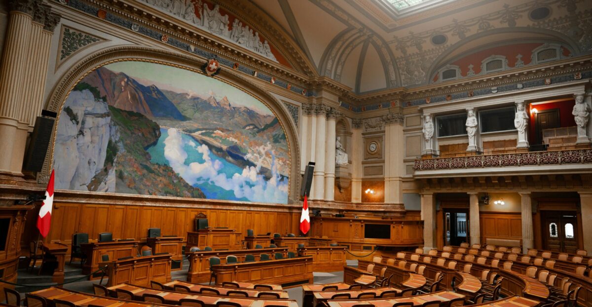 a large room with a painting on the wall