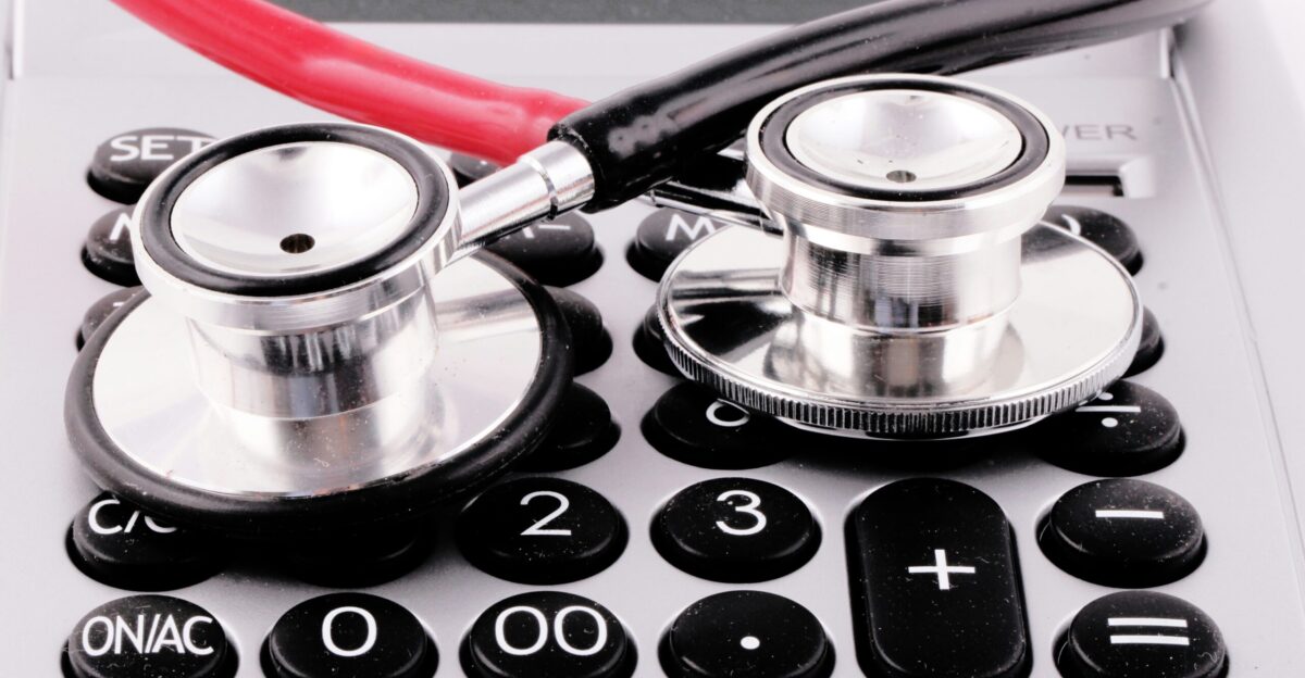 a stethoscope sitting on top of a calculator