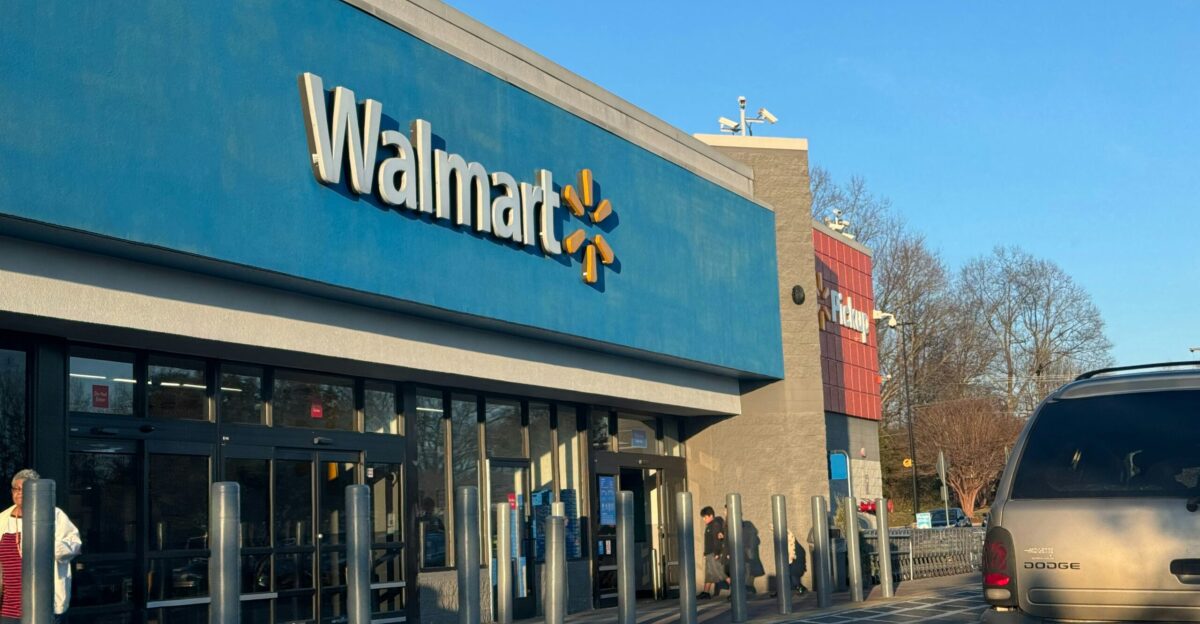 a walmart store with a car parked in front of it
