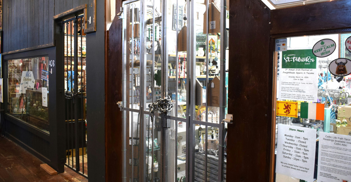 a store front with glass doors and a wooden floor