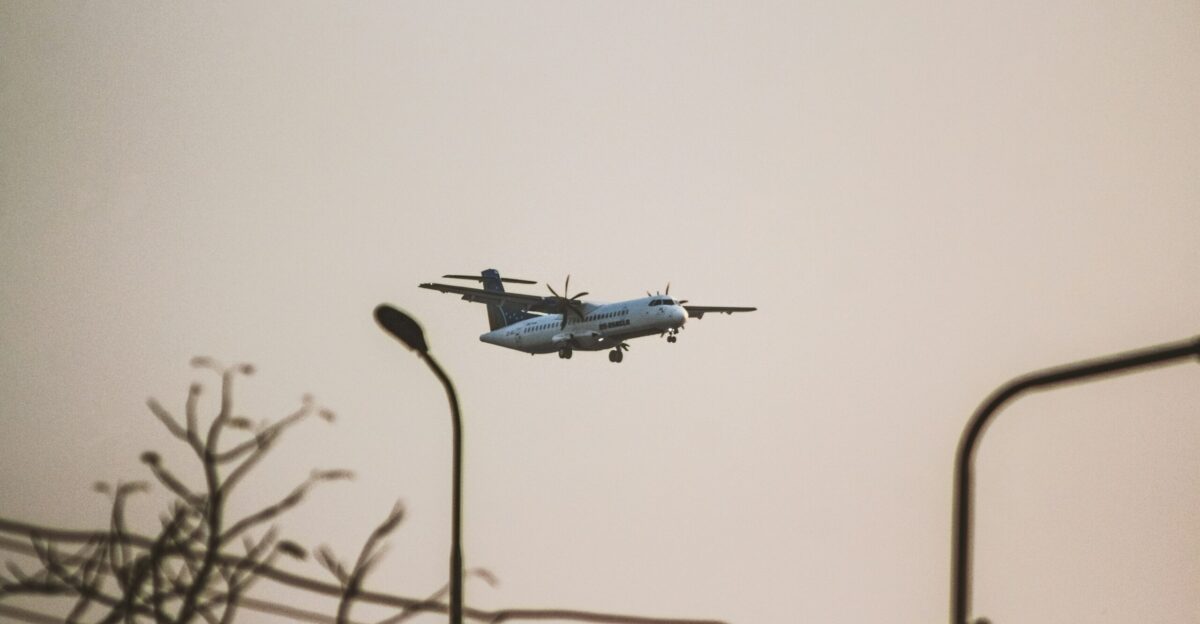 a plane is flying low to the ground