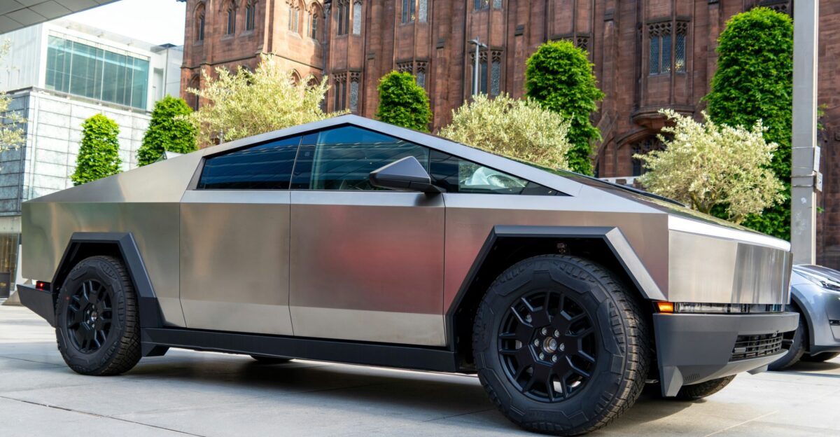 a futuristic car parked in front of a building