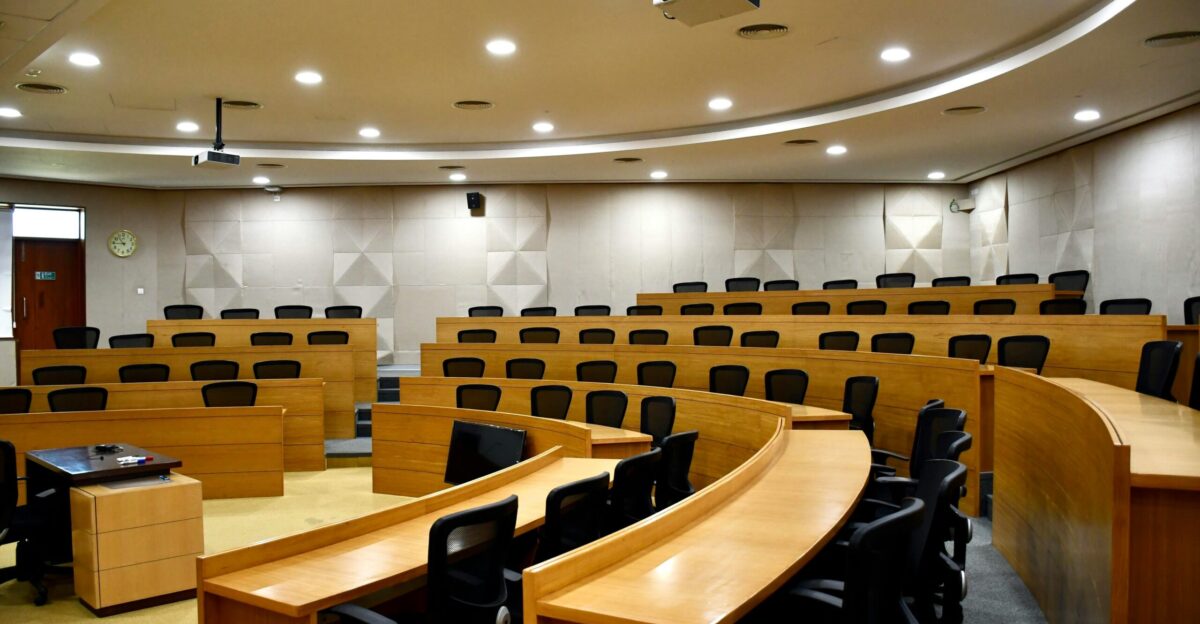 A room filled with lots of wooden desks