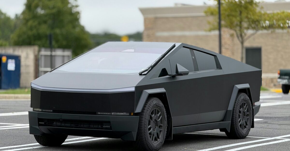 A futuristic car is parked in a parking lot