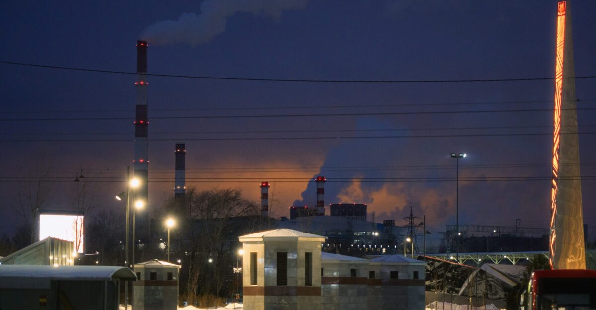 A factory with a lot of smoke coming out of it