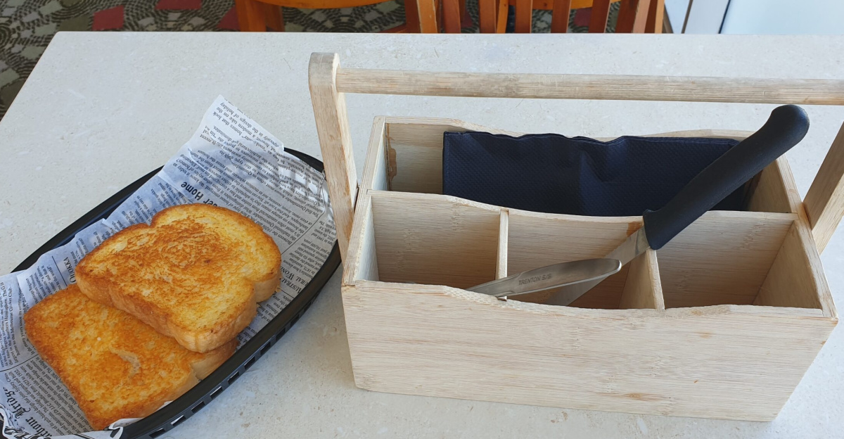 The signature cheesy toast and cutlery box at a table in the Sizzler Innaloo restaurant in Woodlands, Western Australia