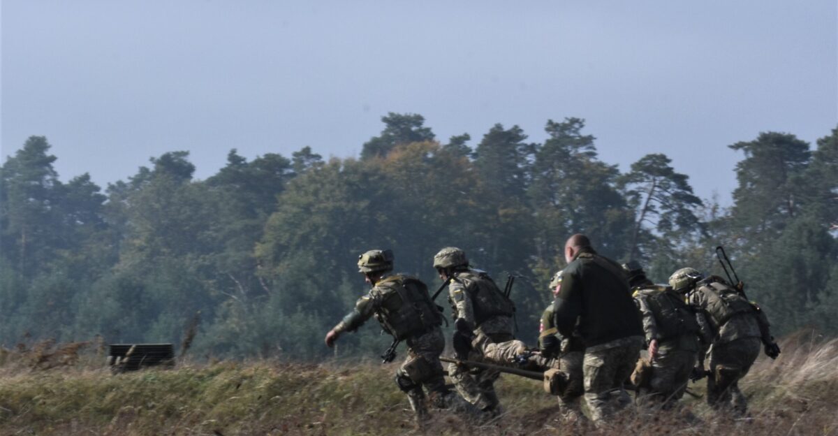 Ukrainian soldiers perform an aeromedical evacuation for a simulated injured soldier as part of the field training exercise Sept 24 2019 during Rapid Trident 2019 near Yavoriv Ukraine RT19 is an annual multinational exercise which involves approximately 3 700 personnel from 14 nations that supports joint combined interoperability among the partner militaries of Ukraine and the United States as well as Partnership for Peace nations and NATO allies U S Army National Guard photo by Staff Sgt Amanda H Johnson