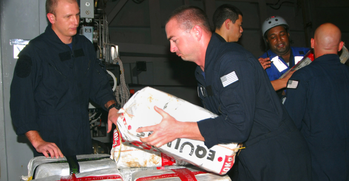 CARIBBEAN SEA (March 12, 2010) Sailors and Coast Guardsmen from the littoral combat ship USS Freedom (LCS 1) stack bales of cocaine dumped overboard by a small boat intercepted by Freedom during counter-illicit trafficking operations in the U.S. 4th Fleet area of responsibility. Freedom recovered two tons of cocaine from the southern Caribbean Sea. (U.S. Navy photo by Lt. Ed Early/Released)