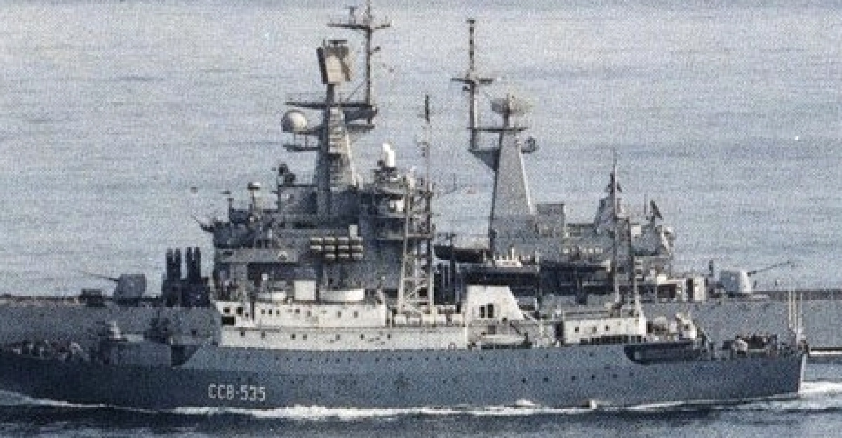 The Soviet <i>Meridian</i>-class intelligence collection ship <i>Kareliya</i> (SSV-535) steaming alongside the U.S. Navy guided missile cruiser USS <i>Texas</i> (CGN-39). <i>Texas</i> was assigned to the aircraft carrier USS <i>Carl Vinson</i> (CVN-70) for a deployment in the Western Pacific from 15 June to 16 December 1988.
