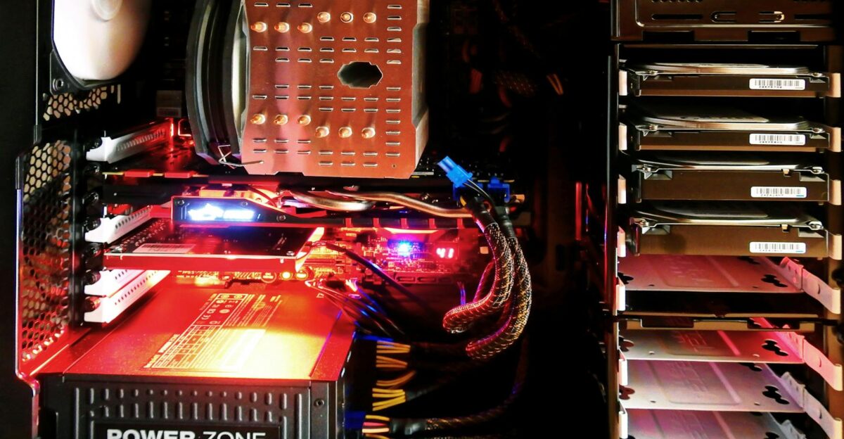 Close-up of a custom gaming PC with RGB lighting showcasing power supply and components