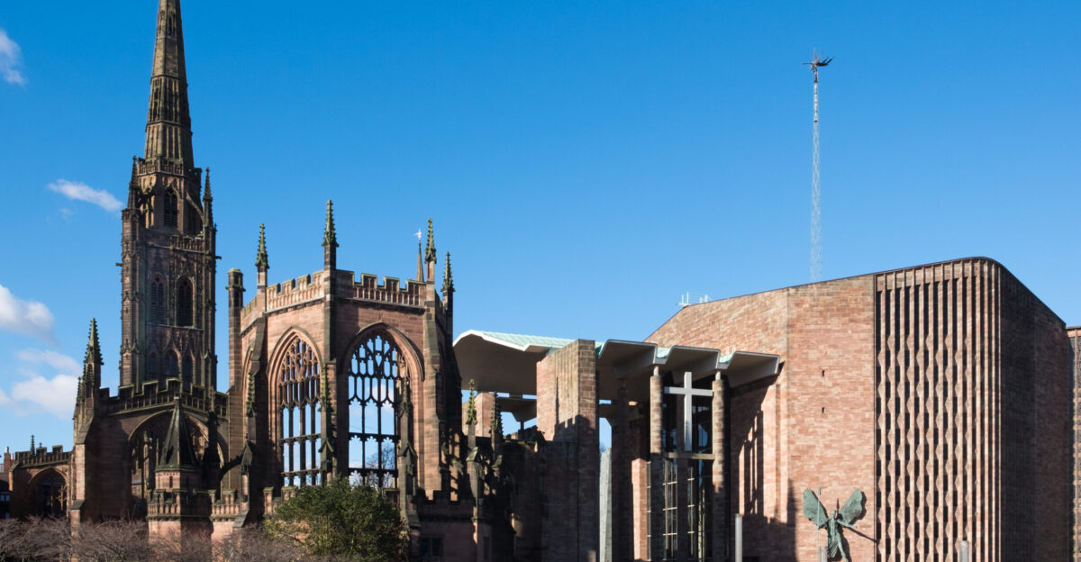 Coventry Cathedral comprising the war-ruined 14th-century St Michael s Cathedral on the left its 90-metre spire survived intact and the 1960s Cathedral Church of St Michael on the right Both are grade I listed buildings in England