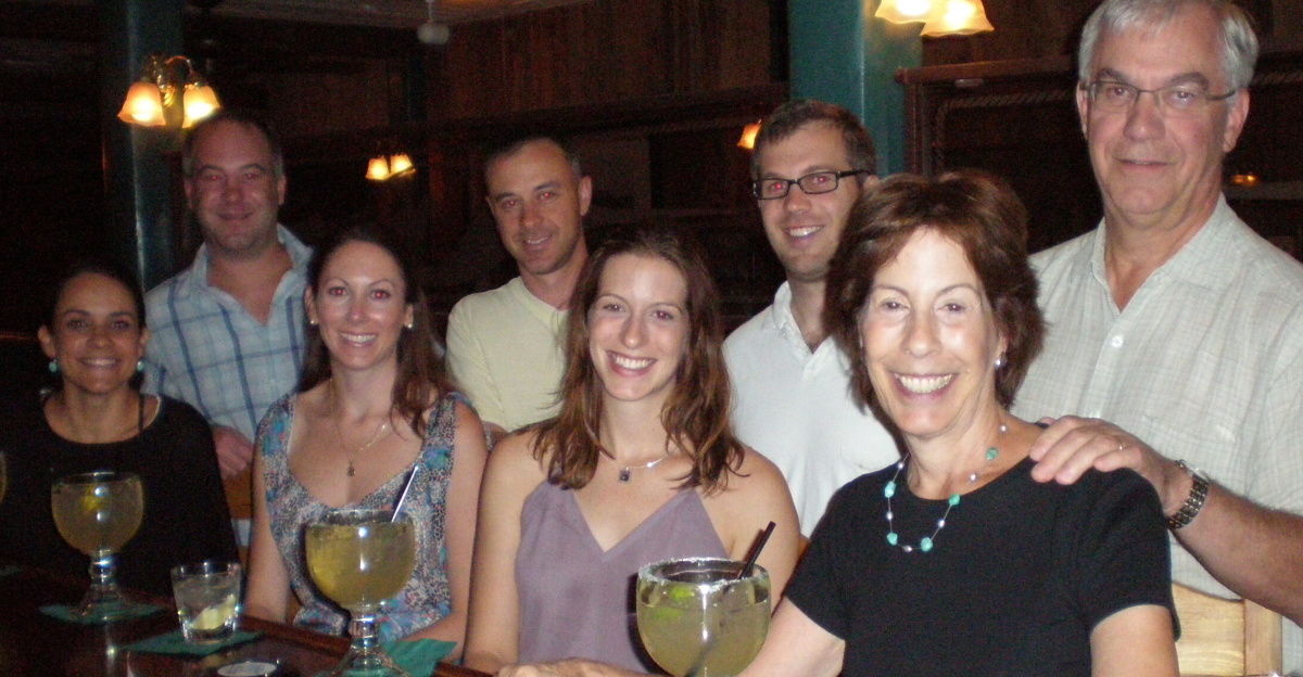 An extended family enjoying drinks at a bar.