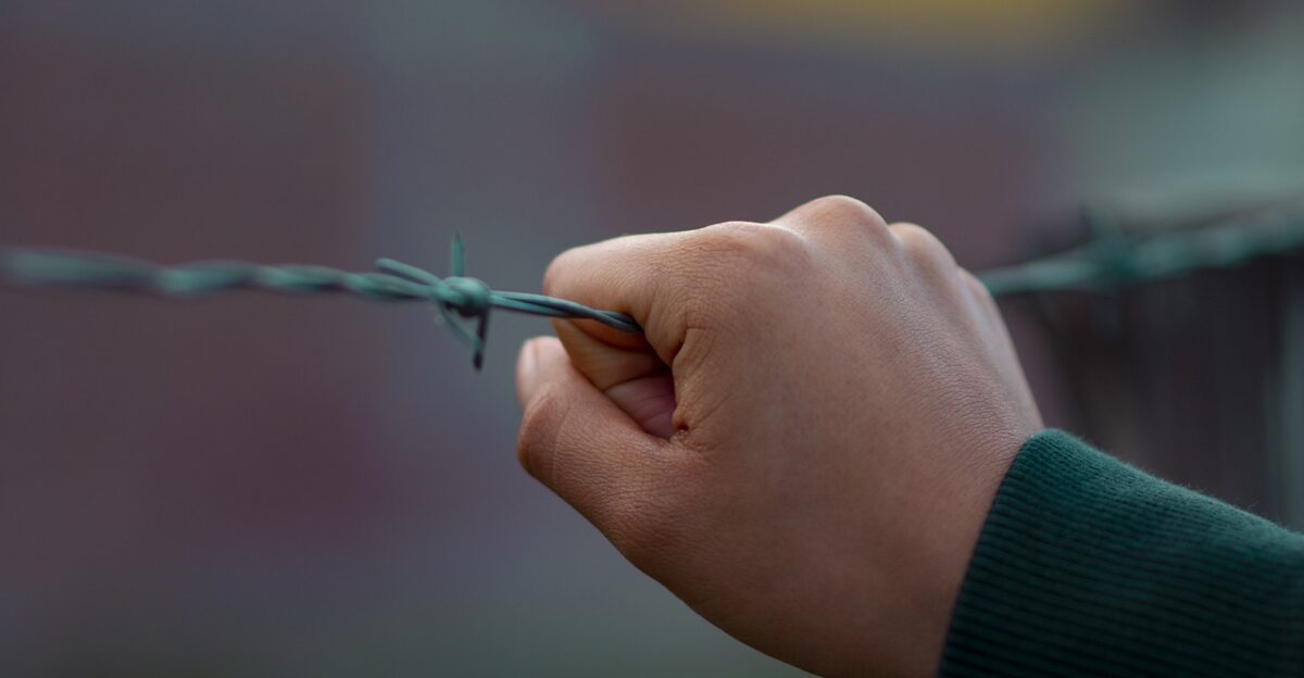 hand barbed wire hands rights policy fence metal stress policy policy policy stress stress stress stress stress