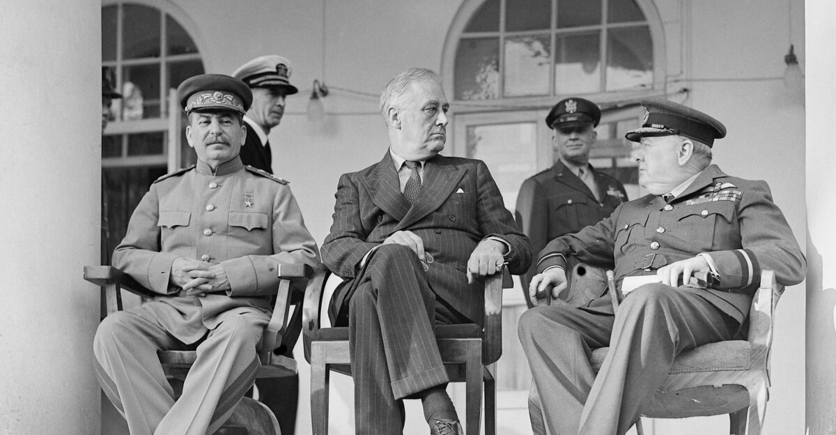 Joseph Stalin Franklin D Roosevelt and Winston Churchill on the veranda of the Soviet Legation in Teheran during the first Big Three Conference November 1943 In the background are aides to the US President