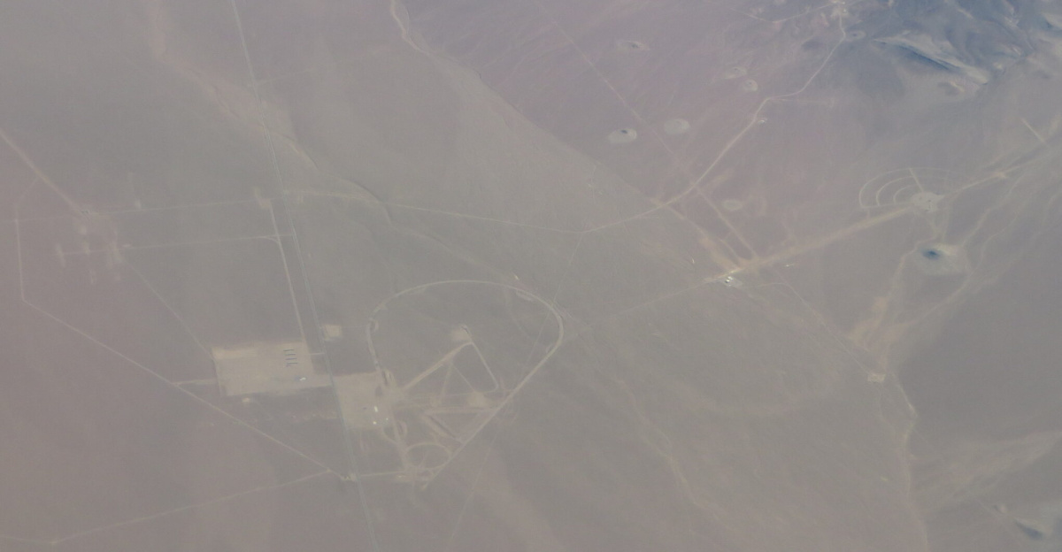 <p>The Nevada National Security Site (NNSS), previously the Nevada Test Site (NTS), is a United States Department of Energy reservation located in southeastern Nye County, Nevada, about 65 miles (105 km) northwest of the city of Las Vegas.
</p><p>Formerly known as the Nevada Proving Grounds, the site was established on 11 January 1951 for the testing of nuclear devices, covering approximately 1,360 square miles (3,500 km2) of desert and mountainous terrain. Nuclear testing at the Nevada Test Site began with a 1-kiloton-of-TNT (4.2 TJ) bomb dropped on Frenchman Flat on 27 January 1951. Many of the iconic images of the nuclear era come from the NTS.
</p><p>During the 1950s, the mushroom clouds from the 100 atmospheric tests could be seen for almost 100 mi (160 km). The city of Las Vegas experienced noticeable seismic effects, and the distant mushroom clouds, which could be seen from the downtown hotels, became tourist attractions. St. George, Utah, received the brunt of the fallout of above-ground nuclear testing in the Yucca Flats/Nevada Test Site. Winds routinely carried the fallout of these tests directly through St. George and southern Utah. Marked increases in cancers, such as leukemia, lymphoma, thyroid cancer, breast cancer, melanoma, bone cancer, brain tumors, and gastrointestinal tract cancers, were reported from the mid-1950s through 1980. The vast majority of nuclear tests, 828 in all, were underground.
</p><p>From 1986 through 1994, two years after the United States put a hold on full-scale nuclear weapons testing, 536 anti-nuclear protests were held at the Nevada Test Site involving 37,488 participants and 15,740 arrests, according to government records.
</p><p>Those arrested included the astronomer Carl Sagan and the actors Kris Kristofferson, Martin Sheen, and Robert Blake.
</p><p>The Nevada Test Site contains 28 areas, 1,100 buildings, 400 miles (640 km) of paved roads, 300 miles of unpaved roads, ten heliports, and two airstrips.
</p><p>The test site offers monthly public tours, often fully booked months in advance. Visitors are not allowed to bring in cameras, binoculars, or cell phones, nor are they permitted to pick up rocks for souvenirs.
</p><p>While there are no longer any explosive tests of nuclear weapons at the site, there is still subcritical testing, used to determine the viability of the United States' aging nuclear arsenal. Additionally, the site is the location of the Area 5 Radioactive Waste Management Complex, which sorts and stores low-level radioactive waste that is not transuranic and has a half life not longer than 20 years. Bechtel Nevada Corporation (a joint venture of Lockheed Martin, Bechtel, and Johnson Controls) ran this complex until 2006. Several other companies won the bid for the contract since and combined to form a new company called National Security Technologies, LLC (a joint venture of Northrop Grumman, AECOM, CH2M Hill, and Nuclear Fuel Services). AECOM, known earlier as Holmes and Narver, held the Nevada Test Site contract for many years before Bechtel Nevada Corp. had it.
</p><p>The Radiological/Nuclear WMD Incident Exercise Site (T-1), which replicates multiple terrorist radiological incidents with train, plane, automobile, truck, and helicopter props is located in Area 1, at the former site of tests EASY, SIMON, APPLE-2, and GALILEO.
</p><p><a href="https://en.wikipedia.org/wiki/Nevada_Test_Site" class="extiw" title="en:Nevada Test Site">en.wikipedia.org/wiki/Nevada_Test_Site</a>
</p>
<a href="https://en.wikipedia.org/wiki/Wikipedia:Text_of_Creative_Commons_Attribution-ShareAlike_3.0_Unported_License" class="extiw" title="en:Wikipedia:Text of Creative Commons Attribution-ShareAlike 3.0 Unported License">en.wikipedia.org/wiki/Wikipedia:Text_of_Creative_Commons_...</a>