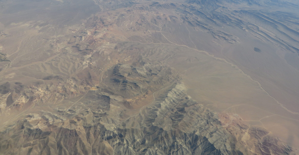 <p>The Nevada National Security Site (NNSS), previously the Nevada Test Site (NTS), is a United States Department of Energy reservation located in southeastern Nye County, Nevada, about 65 miles (105 km) northwest of the city of Las Vegas.
</p><p>Formerly known as the Nevada Proving Grounds, the site was established on 11 January 1951 for the testing of nuclear devices, covering approximately 1,360 square miles (3,500 km2) of desert and mountainous terrain. Nuclear testing at the Nevada Test Site began with a 1-kiloton-of-TNT (4.2 TJ) bomb dropped on Frenchman Flat on 27 January 1951. Many of the iconic images of the nuclear era come from the NTS.
</p><p>During the 1950s, the mushroom clouds from the 100 atmospheric tests could be seen for almost 100 mi (160 km). The city of Las Vegas experienced noticeable seismic effects, and the distant mushroom clouds, which could be seen from the downtown hotels, became tourist attractions. St. George, Utah, received the brunt of the fallout of above-ground nuclear testing in the Yucca Flats/Nevada Test Site. Winds routinely carried the fallout of these tests directly through St. George and southern Utah. Marked increases in cancers, such as leukemia, lymphoma, thyroid cancer, breast cancer, melanoma, bone cancer, brain tumors, and gastrointestinal tract cancers, were reported from the mid-1950s through 1980. The vast majority of nuclear tests, 828 in all, were underground.
</p><p>From 1986 through 1994, two years after the United States put a hold on full-scale nuclear weapons testing, 536 anti-nuclear protests were held at the Nevada Test Site involving 37,488 participants and 15,740 arrests, according to government records.
</p><p>Those arrested included the astronomer Carl Sagan and the actors Kris Kristofferson, Martin Sheen, and Robert Blake.
</p><p>The Nevada Test Site contains 28 areas, 1,100 buildings, 400 miles (640 km) of paved roads, 300 miles of unpaved roads, ten heliports, and two airstrips.
</p><p>The test site offers monthly public tours, often fully booked months in advance. Visitors are not allowed to bring in cameras, binoculars, or cell phones, nor are they permitted to pick up rocks for souvenirs.
</p><p>While there are no longer any explosive tests of nuclear weapons at the site, there is still subcritical testing, used to determine the viability of the United States' aging nuclear arsenal. Additionally, the site is the location of the Area 5 Radioactive Waste Management Complex, which sorts and stores low-level radioactive waste that is not transuranic and has a half life not longer than 20 years. Bechtel Nevada Corporation (a joint venture of Lockheed Martin, Bechtel, and Johnson Controls) ran this complex until 2006. Several other companies won the bid for the contract since and combined to form a new company called National Security Technologies, LLC (a joint venture of Northrop Grumman, AECOM, CH2M Hill, and Nuclear Fuel Services). AECOM, known earlier as Holmes and Narver, held the Nevada Test Site contract for many years before Bechtel Nevada Corp. had it.
</p><p>The Radiological/Nuclear WMD Incident Exercise Site (T-1), which replicates multiple terrorist radiological incidents with train, plane, automobile, truck, and helicopter props is located in Area 1, at the former site of tests EASY, SIMON, APPLE-2, and GALILEO.
</p><p><a href="https://en.wikipedia.org/wiki/Nevada_Test_Site" class="extiw" title="en:Nevada Test Site">en.wikipedia.org/wiki/Nevada_Test_Site</a>
</p>
<a href="https://en.wikipedia.org/wiki/Wikipedia:Text_of_Creative_Commons_Attribution-ShareAlike_3.0_Unported_License" class="extiw" title="en:Wikipedia:Text of Creative Commons Attribution-ShareAlike 3.0 Unported License">en.wikipedia.org/wiki/Wikipedia:Text_of_Creative_Commons_...</a>