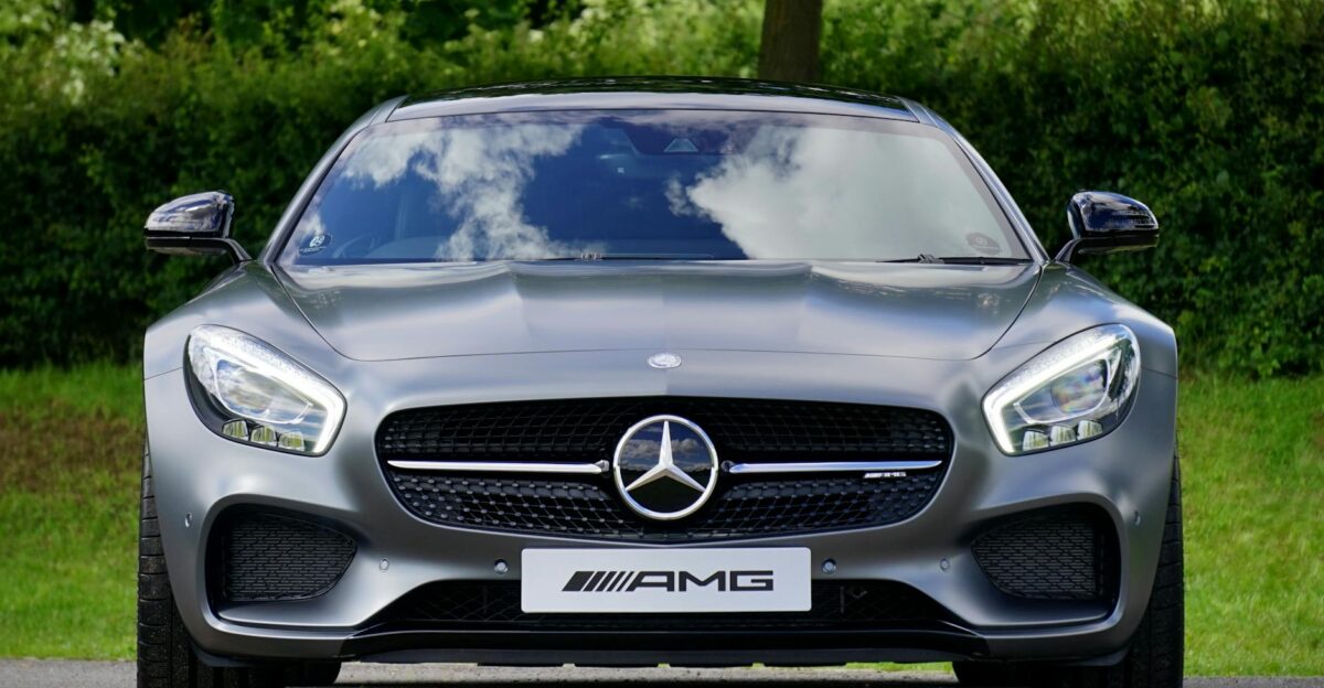 Front view of a luxury Mercedes-Benz AMG against a natural backdrop