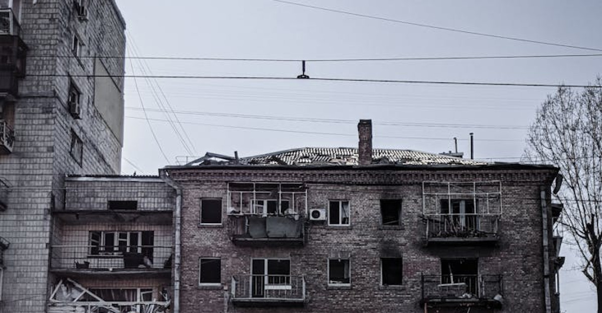Image of a bomb-damaged residential building in Kyiv Ukraine highlighting wartime devastation