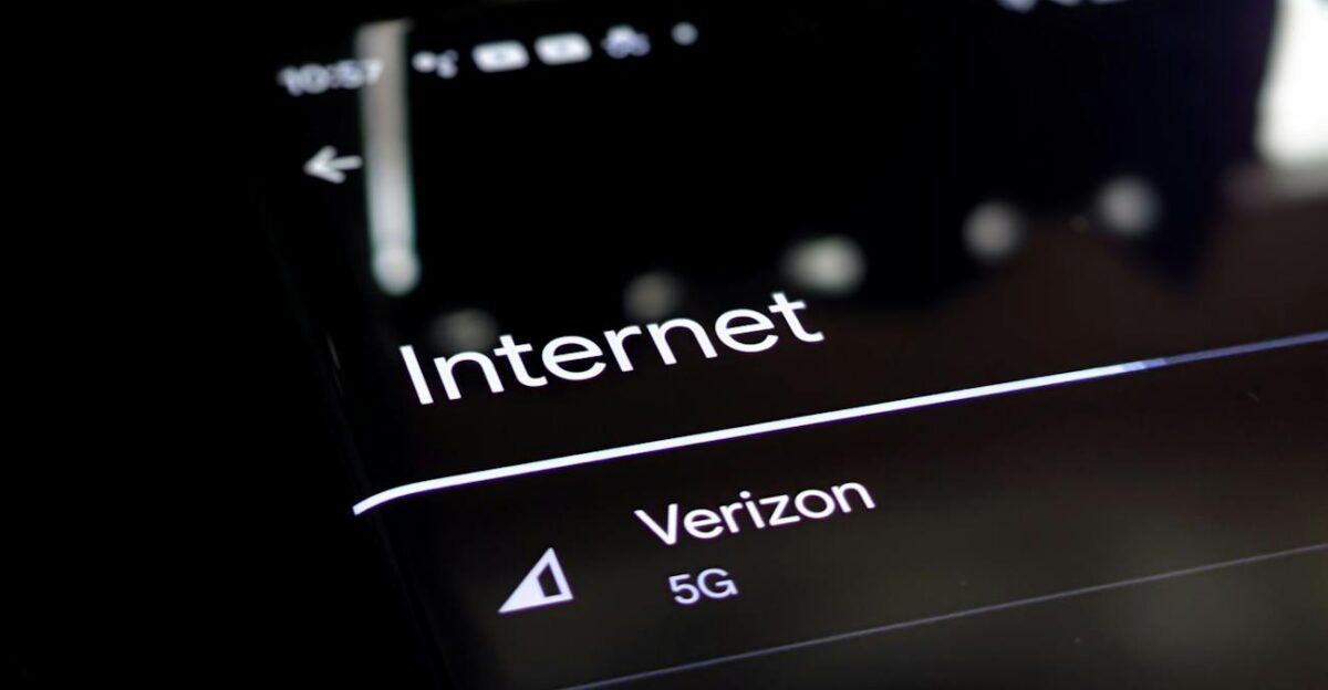 Close-up of a smartphone screen displaying internet connection details with Verizon 5G and Wi-Fi options