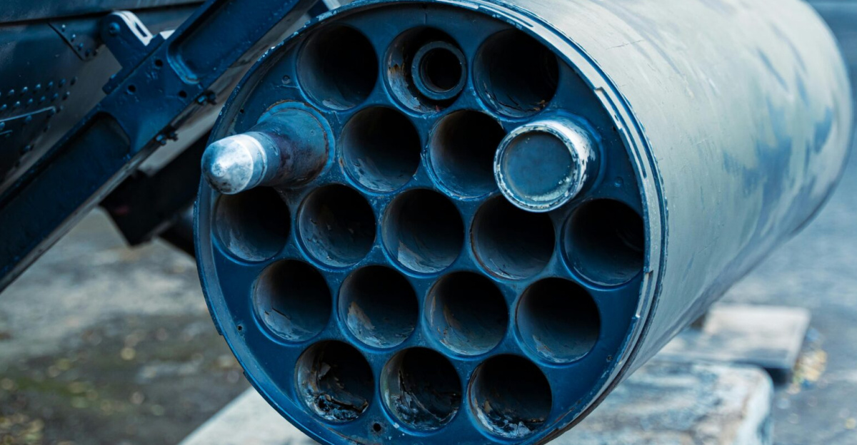 Detailed view of a military rocket launcher showcased outdoors, showcasing industrial design.
