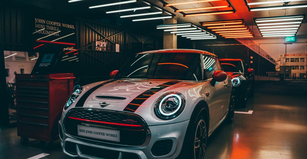 Vibrant Mini Cooper display in a stylish showroom with striking lighting