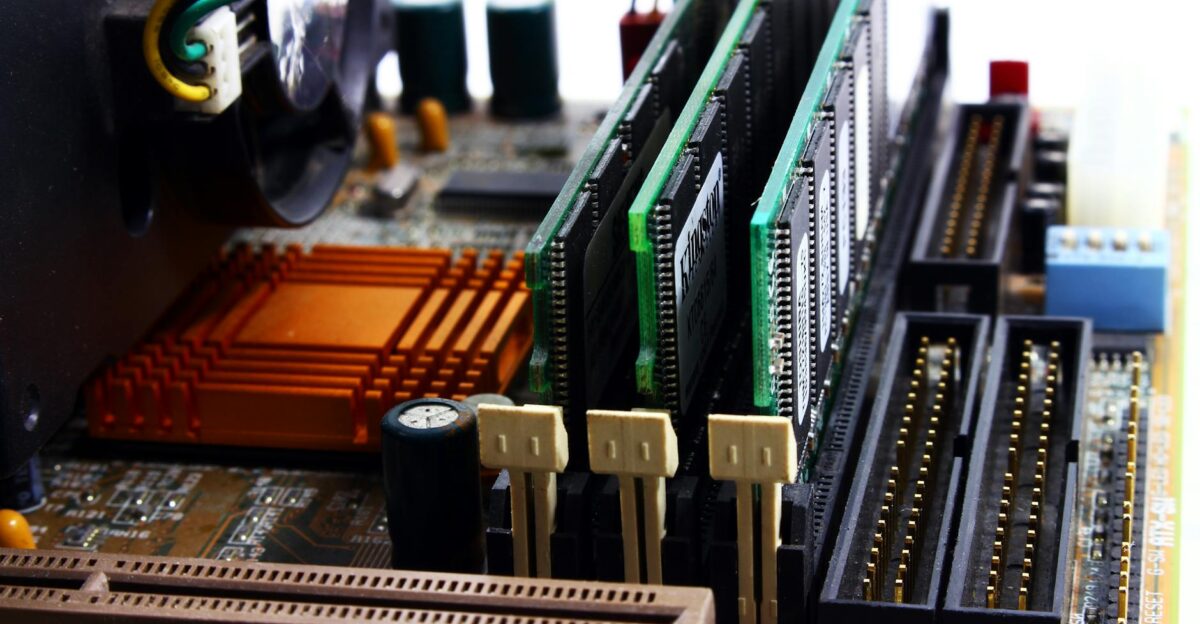 Detailed view of computer motherboard featuring RAM chipset and wiring