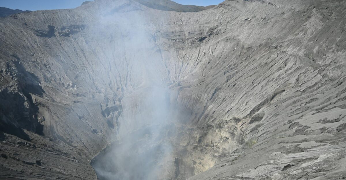 A high-resolution view of a smoking volcanic crater exhibiting raw natural beauty