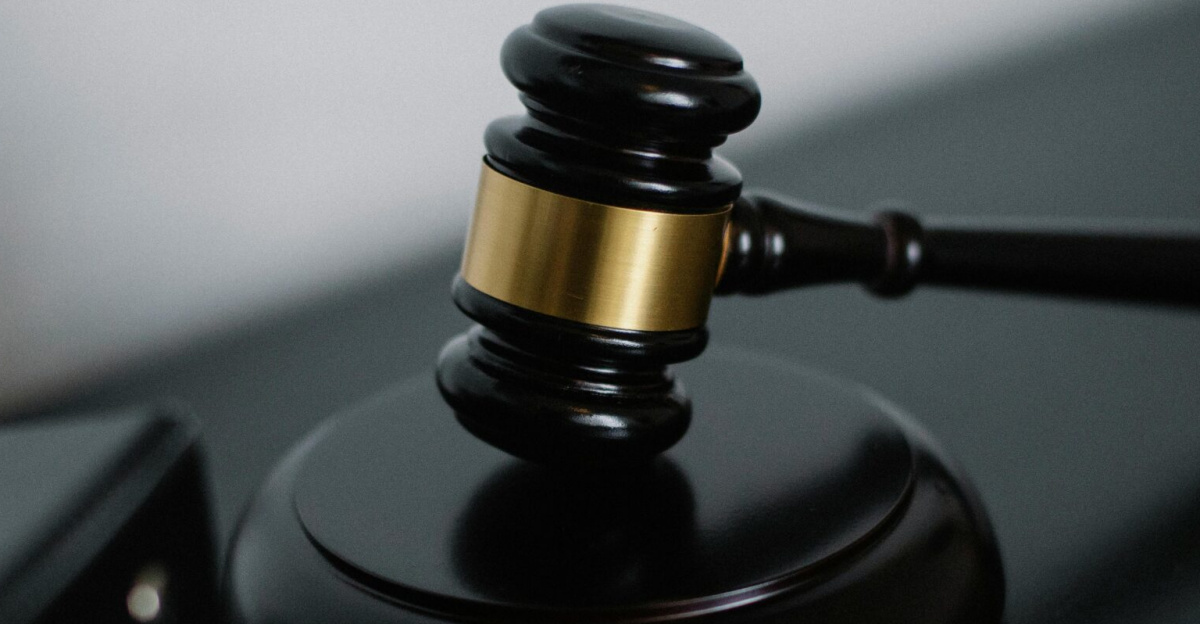 Close-up of a wooden gavel on a desk, symbolizing justice and legal authority.