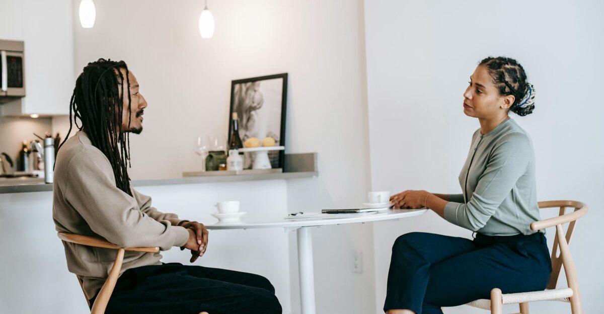 Diverse consultation session in modern office featuring attentive discussion