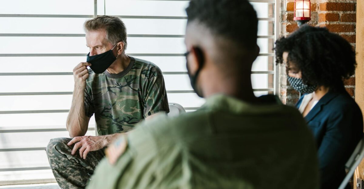 Military veterans in a therapy session supported by a counselor focusing on mental health