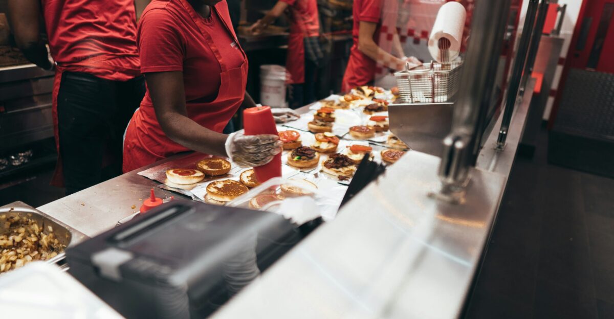 woman preparing a food over the counter