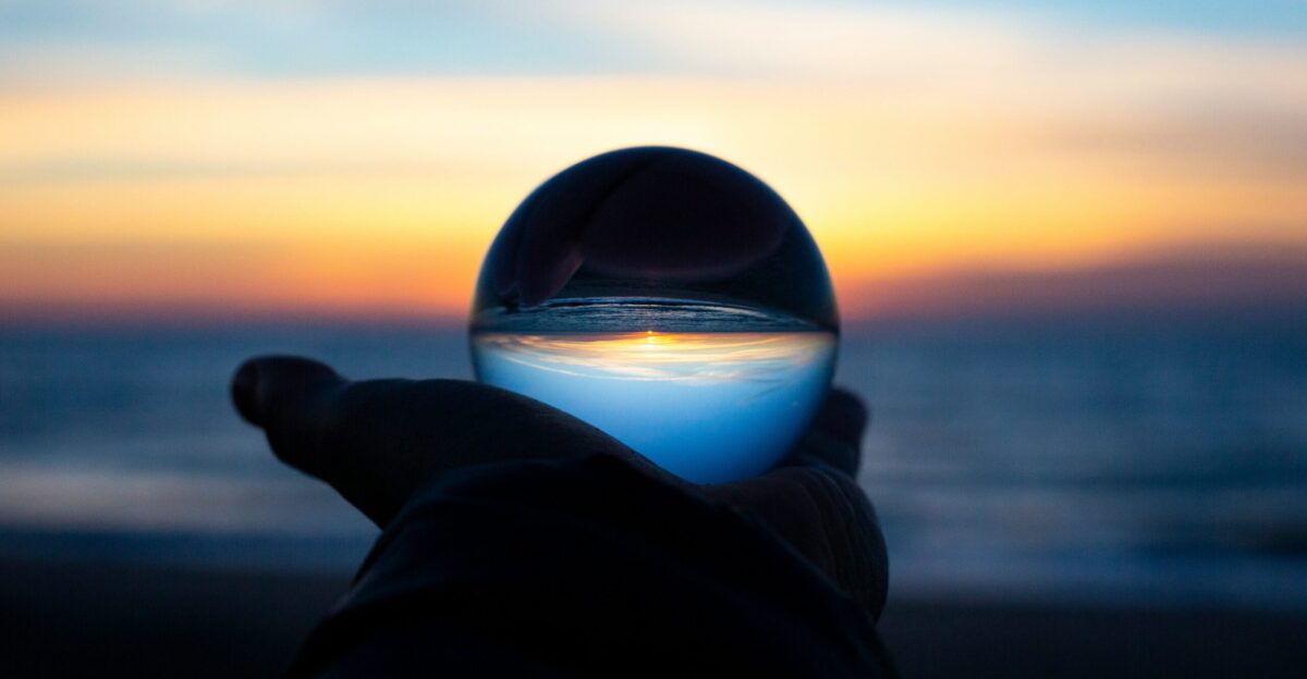 person holding clear glass glass