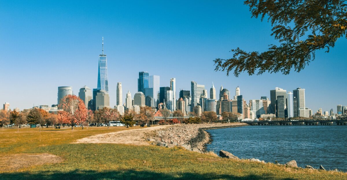 city skyline near body of water during daytime