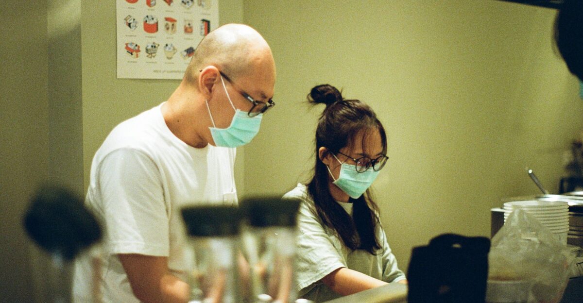 man in white crew neck t-shirt wearing black sunglasses