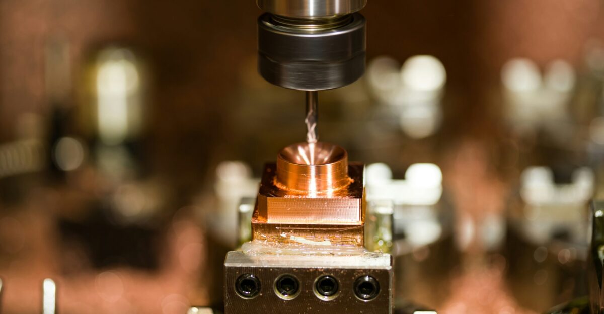 a close up of a machine with a piece of metal on it