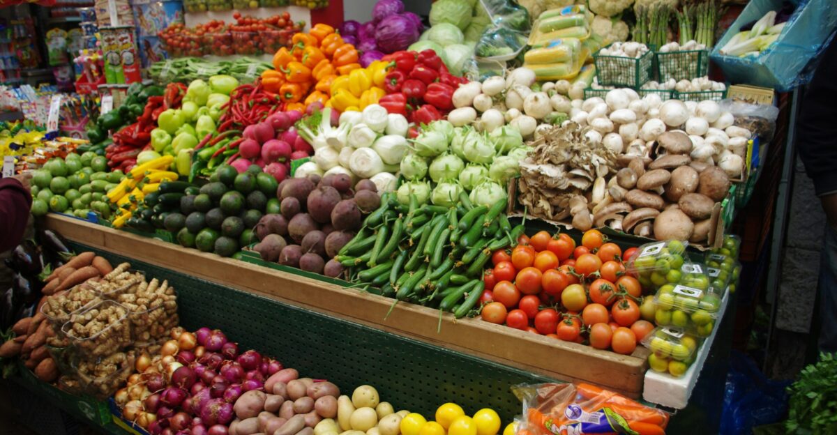 a large display of fruits and vegetables at a market