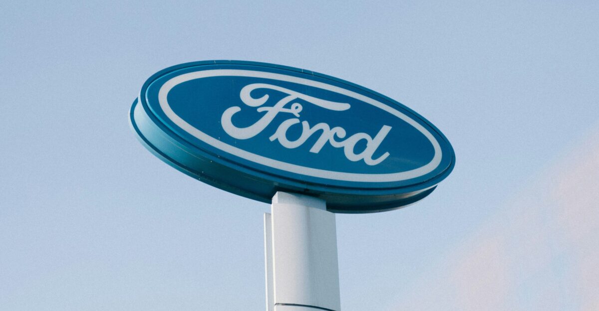a ford sign is shown against a blue sky