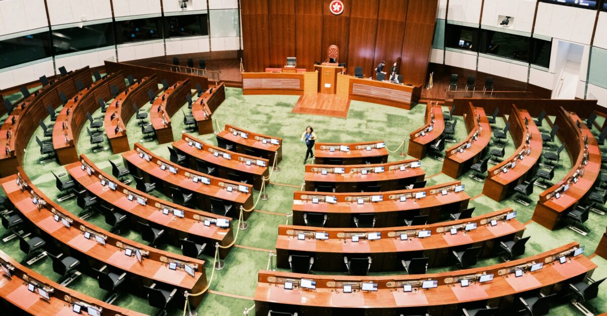 a large room filled with lots of wooden chairs