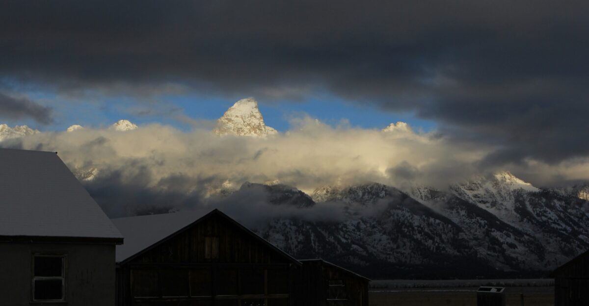 a snow covered mountain range in the distance