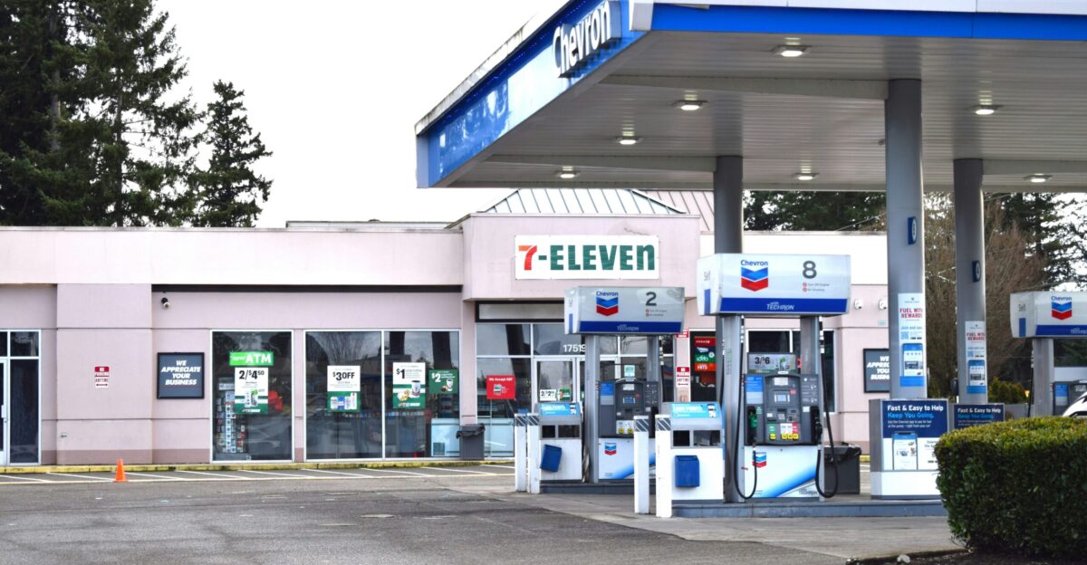 a gas station with a car parked in front of it