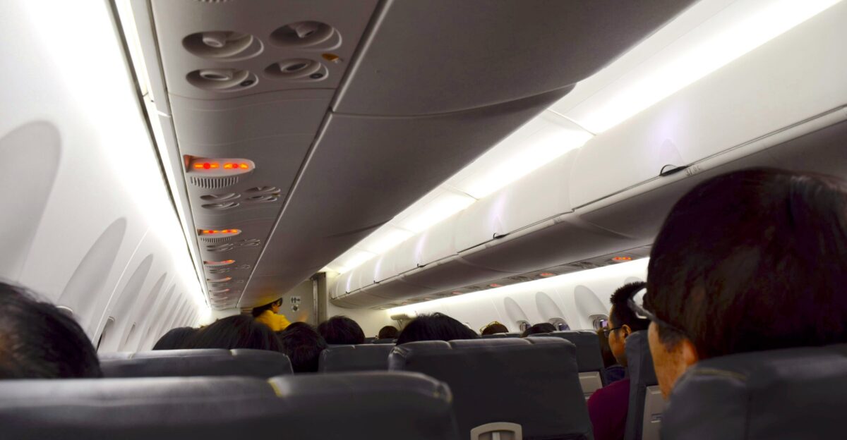 a group of people sitting on an airplane