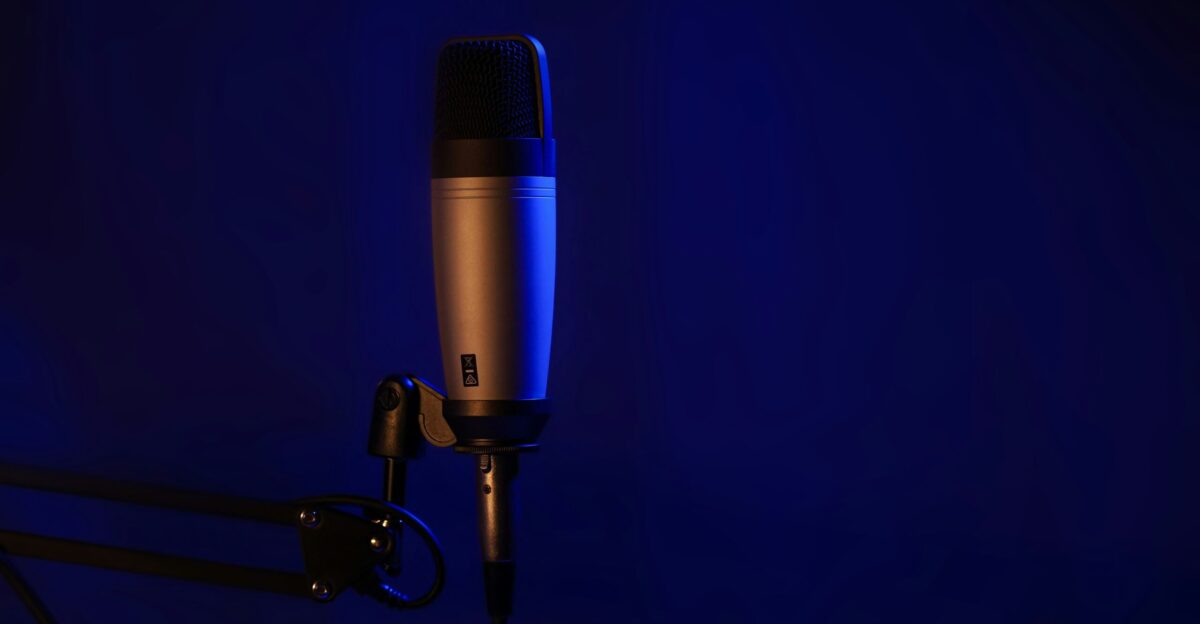 a microphone on a stand in a dark room